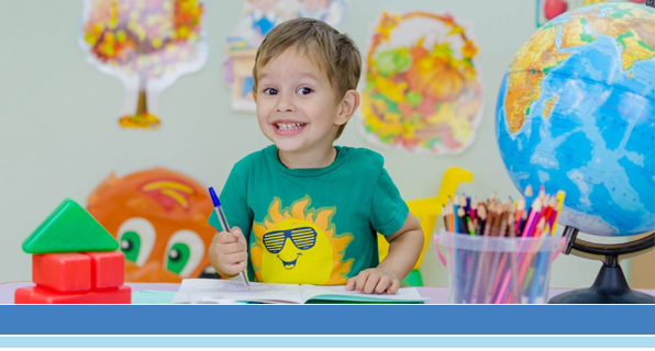 happy young boy in elementary class