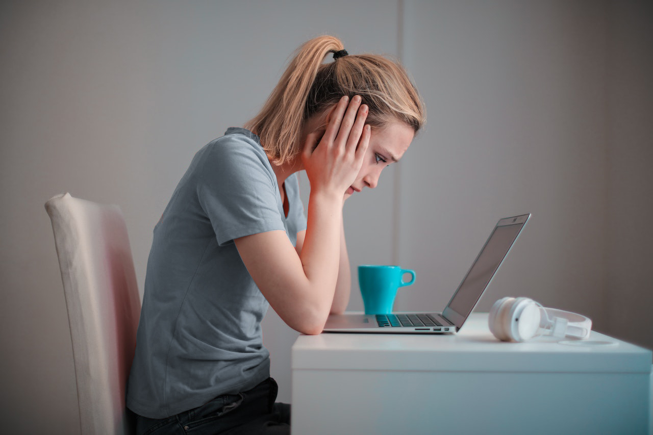 Woman Stressed Staring at Computer