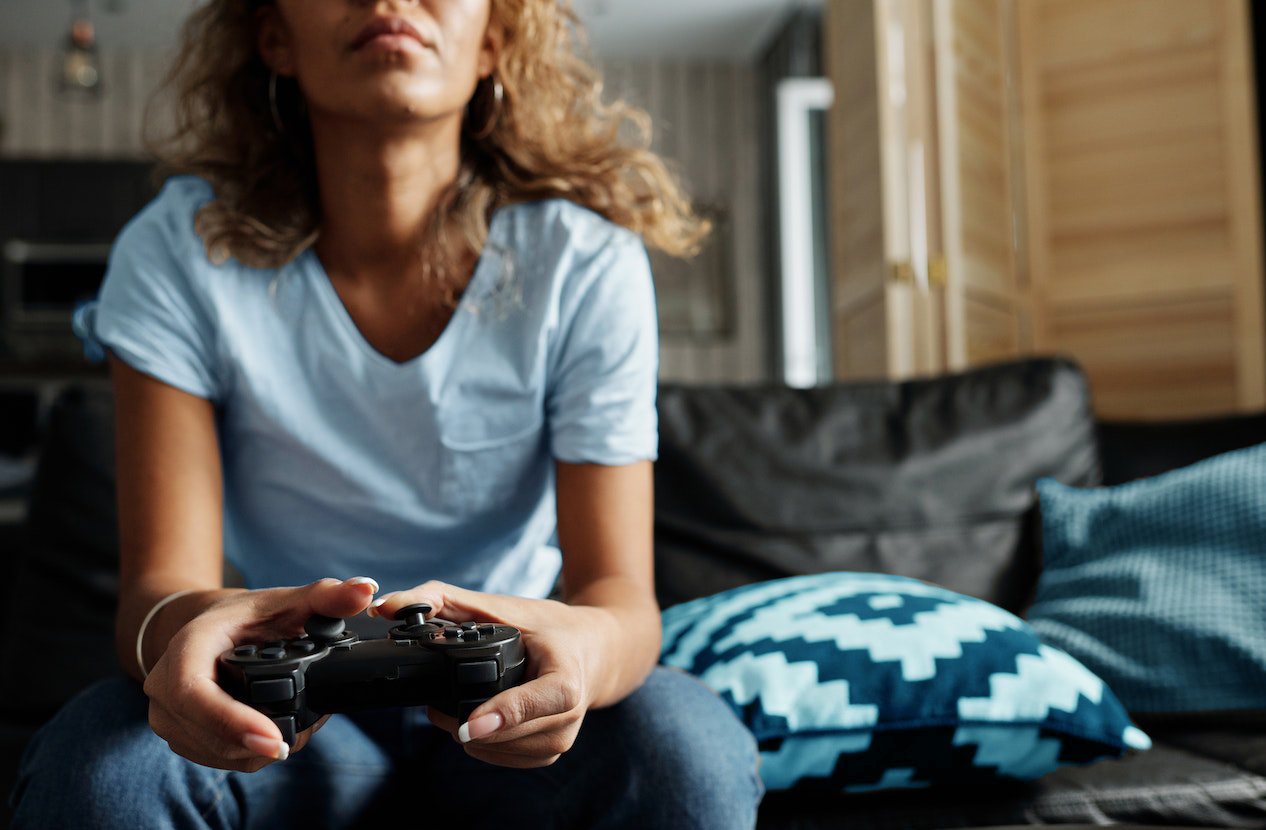 Women on Couch with Video Game Controller