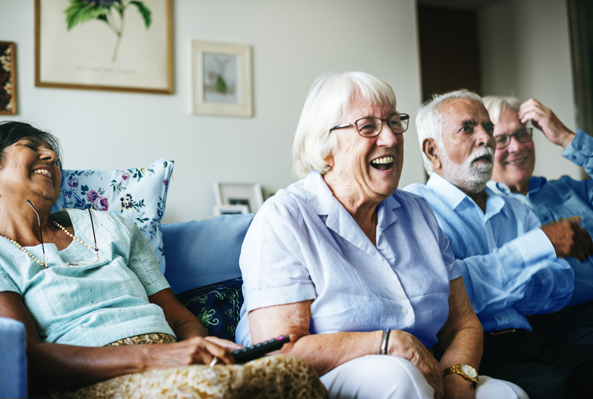Senior Adults Laughing on Couch