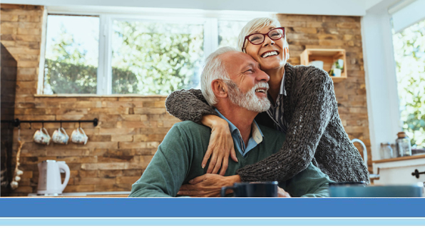 older couple hugging and smiling